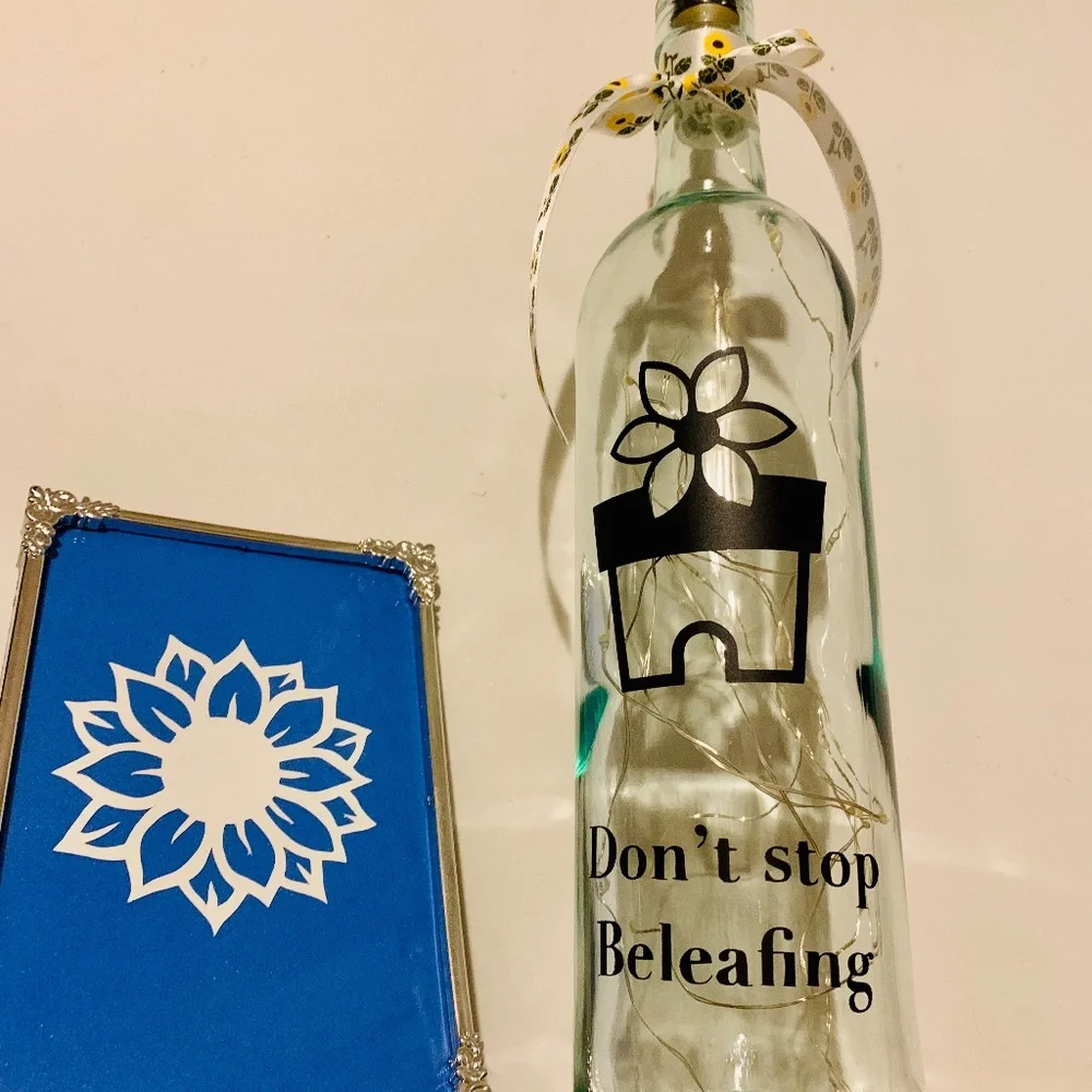 ‘Don’t Stop Beleafing’ logo wine bottle lantern